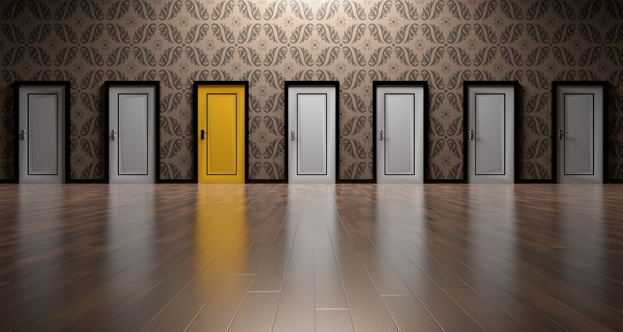 a row of doors symbolizing the variety of exit strategies for startup founders